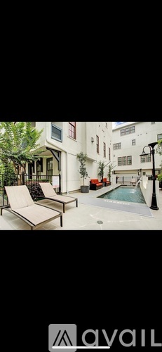 A pool and lounge area in a residential setting.