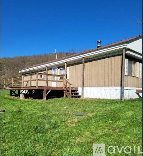 A house with a deck in the backyard.