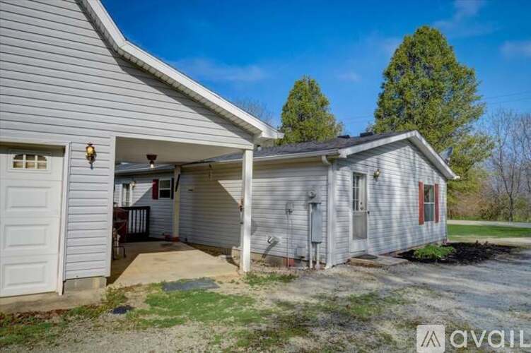 A house with a garage is available for rent.