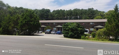 A building with a parking lot in front of it.