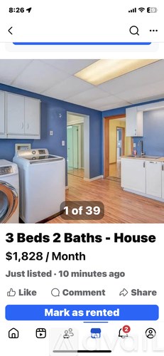 A house rental listing shows a kitchen with white cabinets and a blue wall.