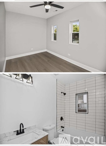 A bathroom with a white tiled shower and a window.