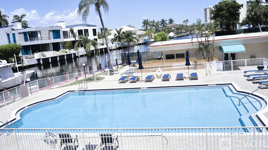 A pool with a metal fence around it.