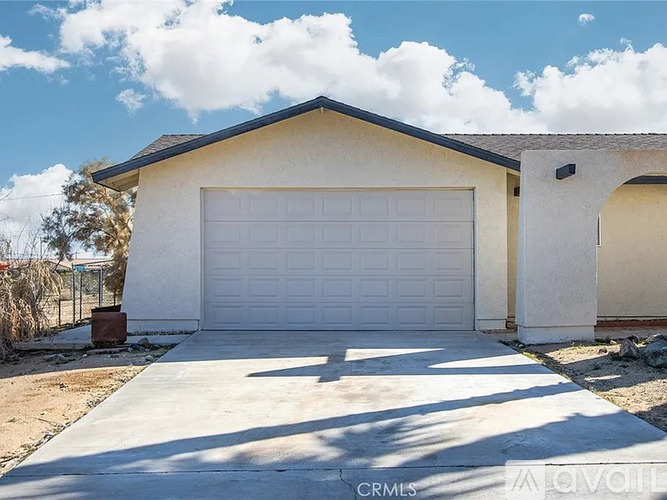 A two-car garage is attached to a house.