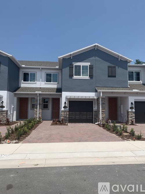 A row of houses with the first one being the most prominent.