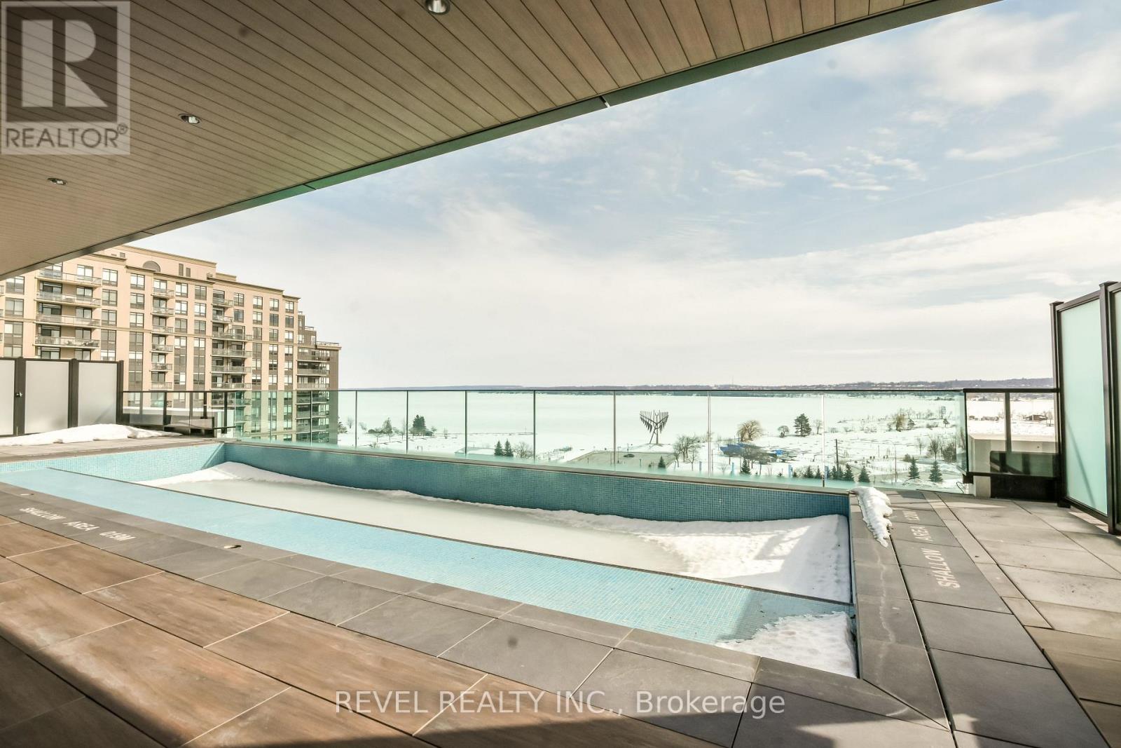 A pool area with a view of a residential building.