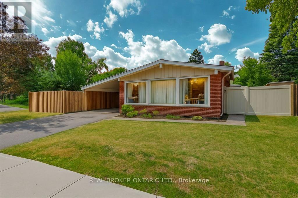A house with a red brick exterior and a white window is for sale in Brokerage by Real-Broker Ontario Ltd.