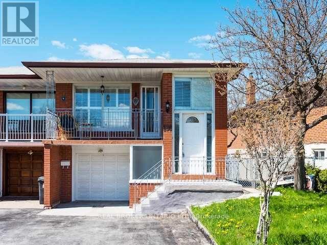 A two-story house with a balcony and a garage.