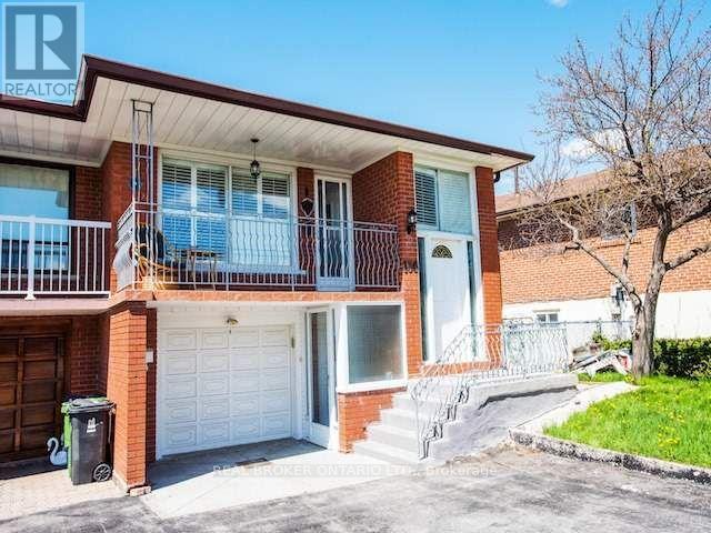 A two-story house with a balcony and a garage.