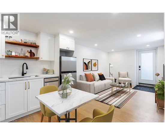 A modern kitchen with a dining table and chairs.