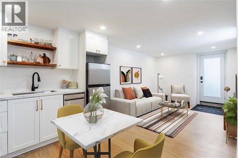 A modern kitchen with a dining table and chairs.
