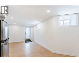 A spacious room with a door and a window.