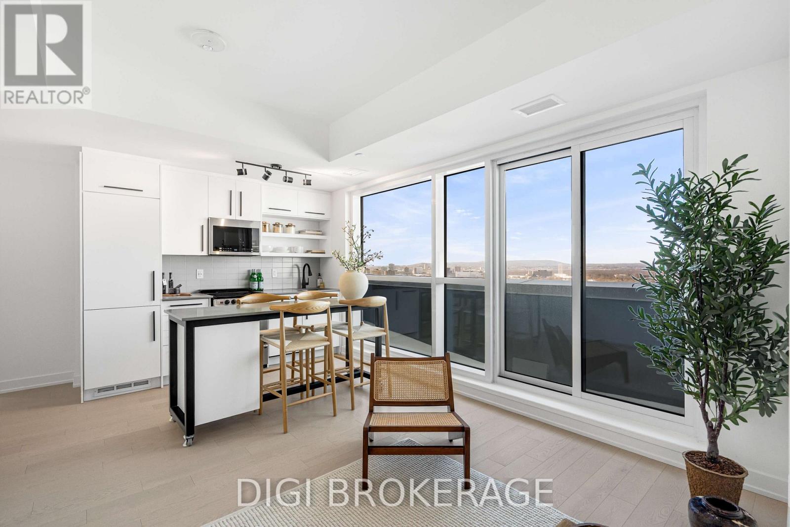 A modern kitchen with a dining table and chairs.