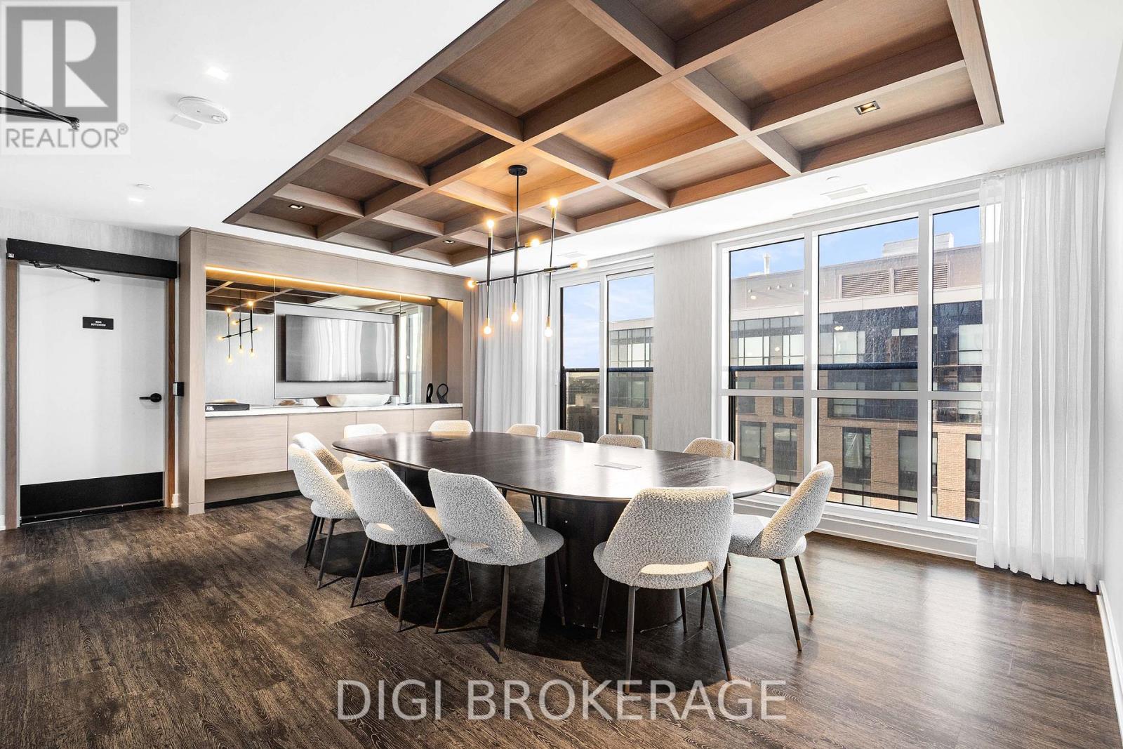 A modern dining room with a wooden table and chairs.