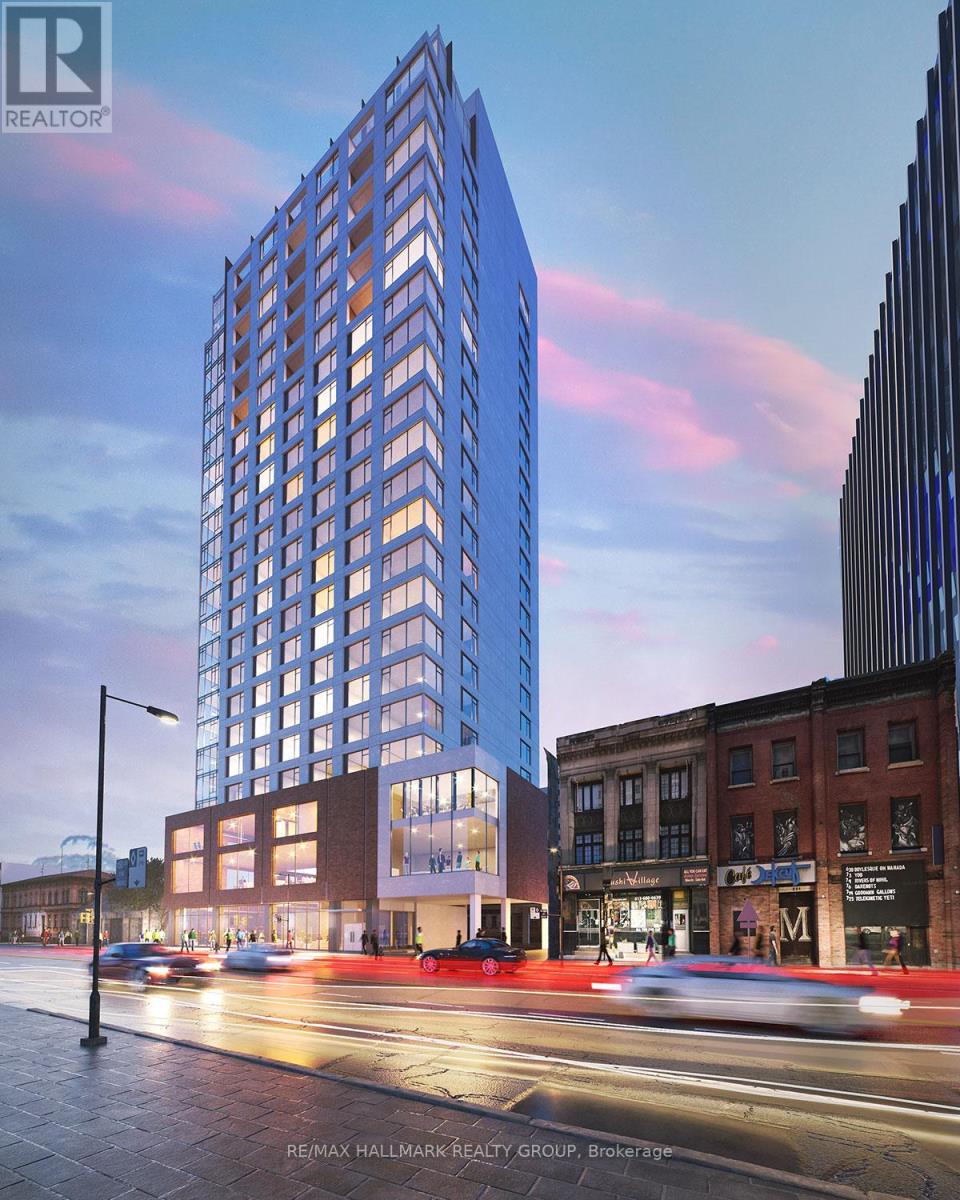 A tall blue building with a glass facade is the focal point of the image.