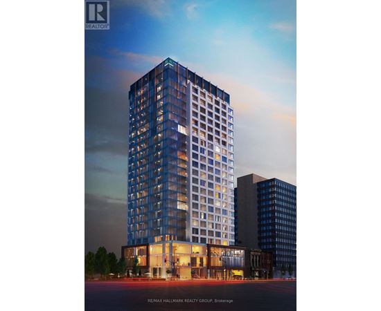 A tall building with a glass facade is the main focus of the image.