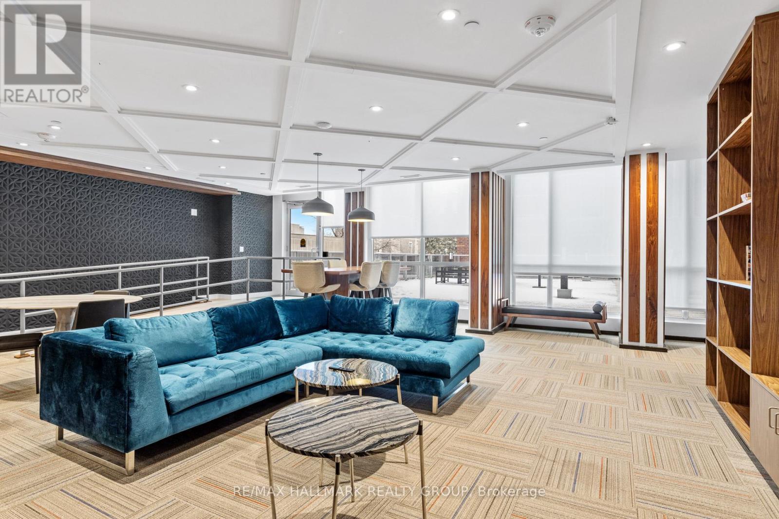A living room with a blue couch and a coffee table.