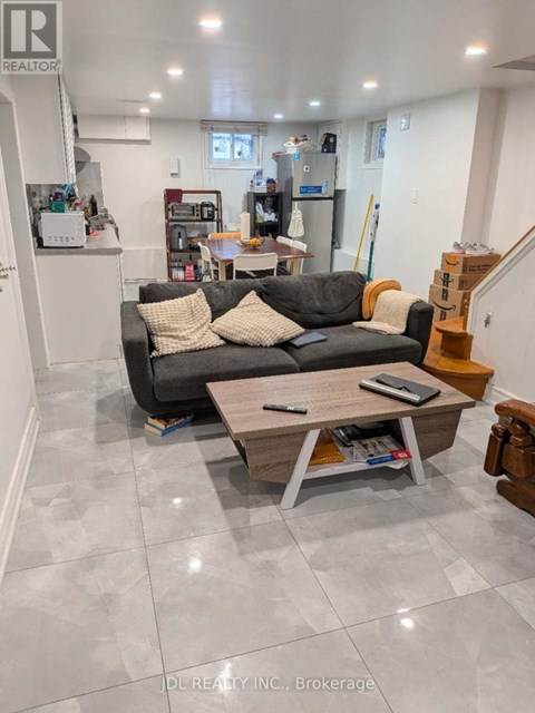 A living room with a grey couch and a coffee table.