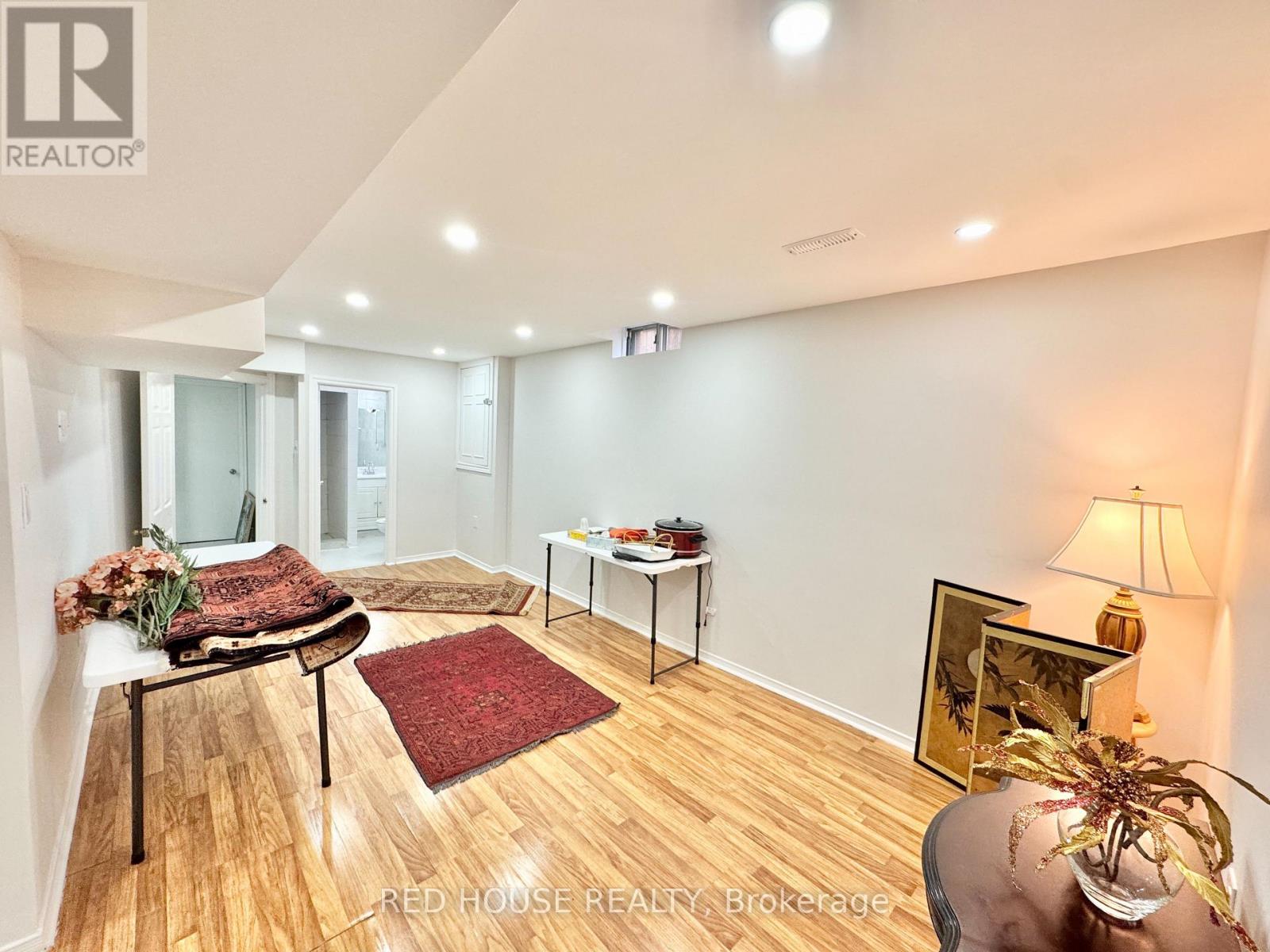 A living room with a couch, chair, and table.