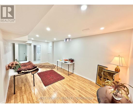 A living room with a couch, chair, and table.