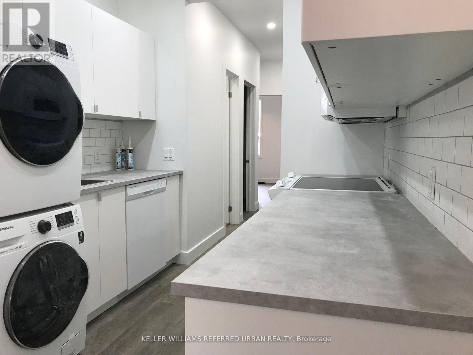 A laundry room with a washer and dryer.