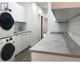 A laundry room with a washer and dryer.