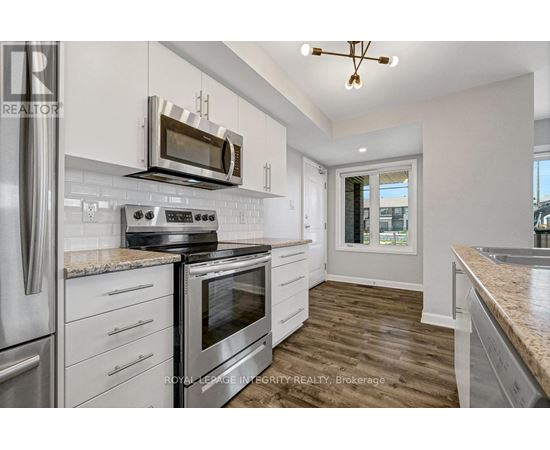 A kitchen with a stove top oven and microwave above it.
