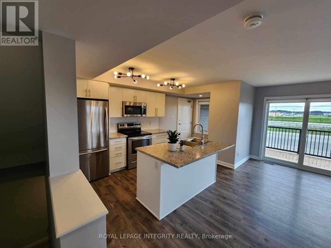 A modern kitchen with a large island in the middle.