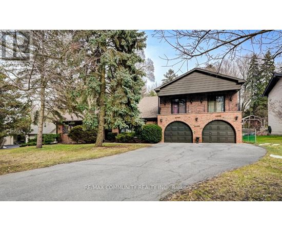 A house with a driveway in front of it.