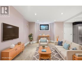 A living room with a television, a couch, and a coffee table.