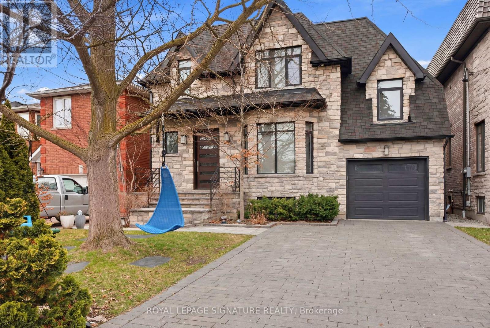 A large house with a driveway in front of it.