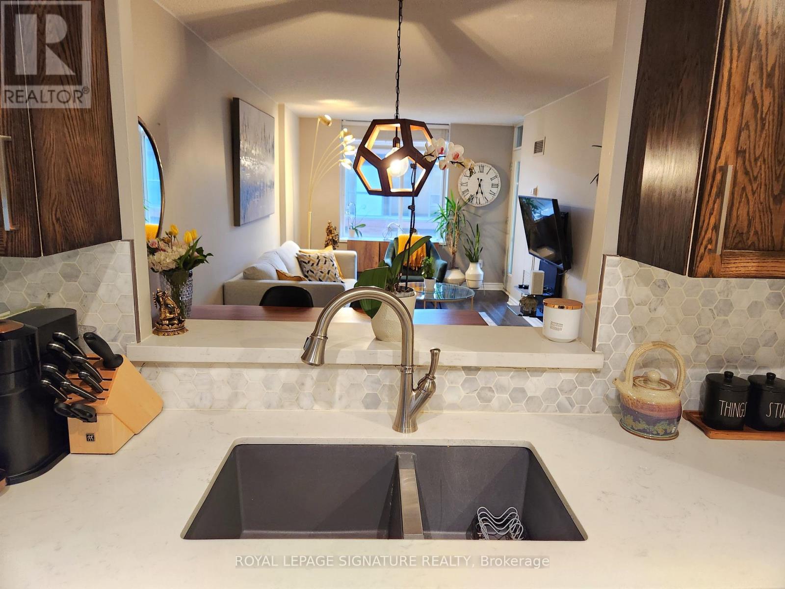 A kitchen with a sink and a window.