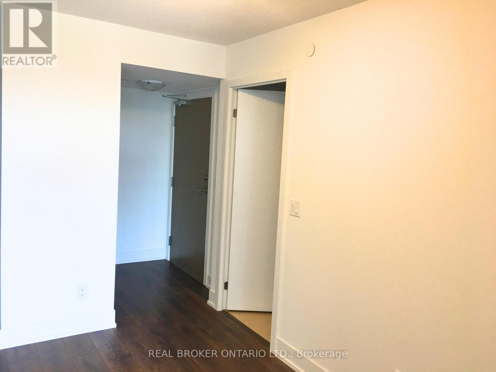 A room with a doorway leading to another room.