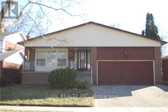 A house with a red garage door is for sale in Brokerage.