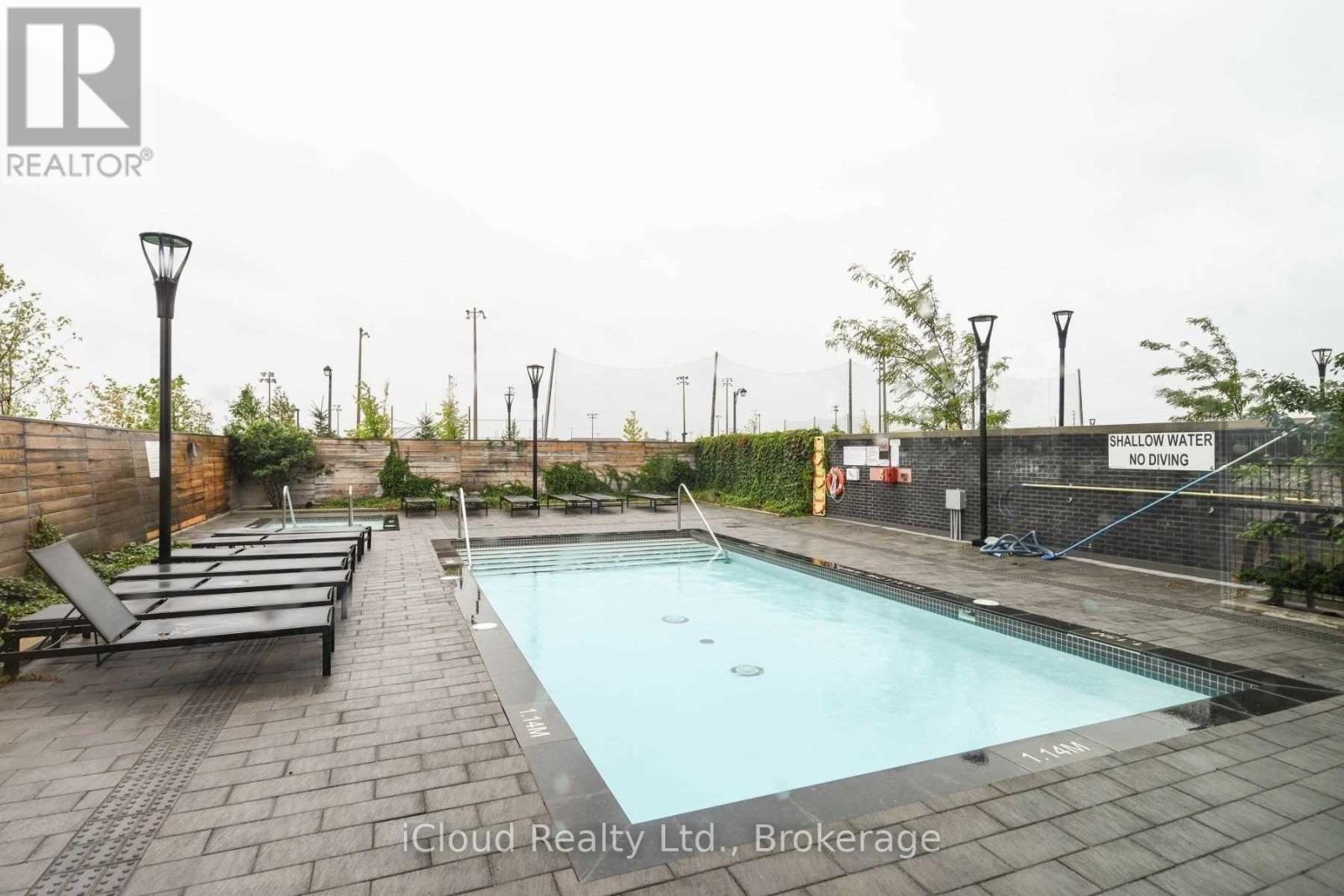 A pool with no diving sign on the wall.