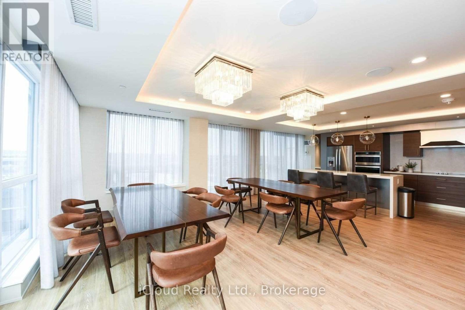 A modern dining room with a large table and chairs.