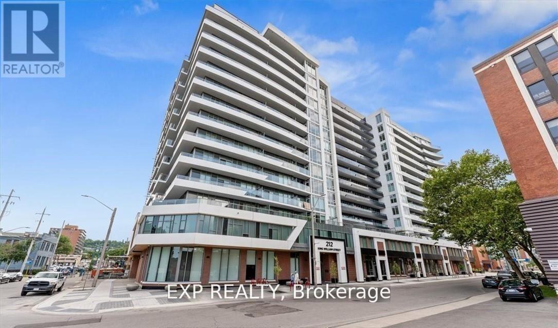 A tall, modern apartment building with the sign "EXP REALTY, Brokerage" in front.