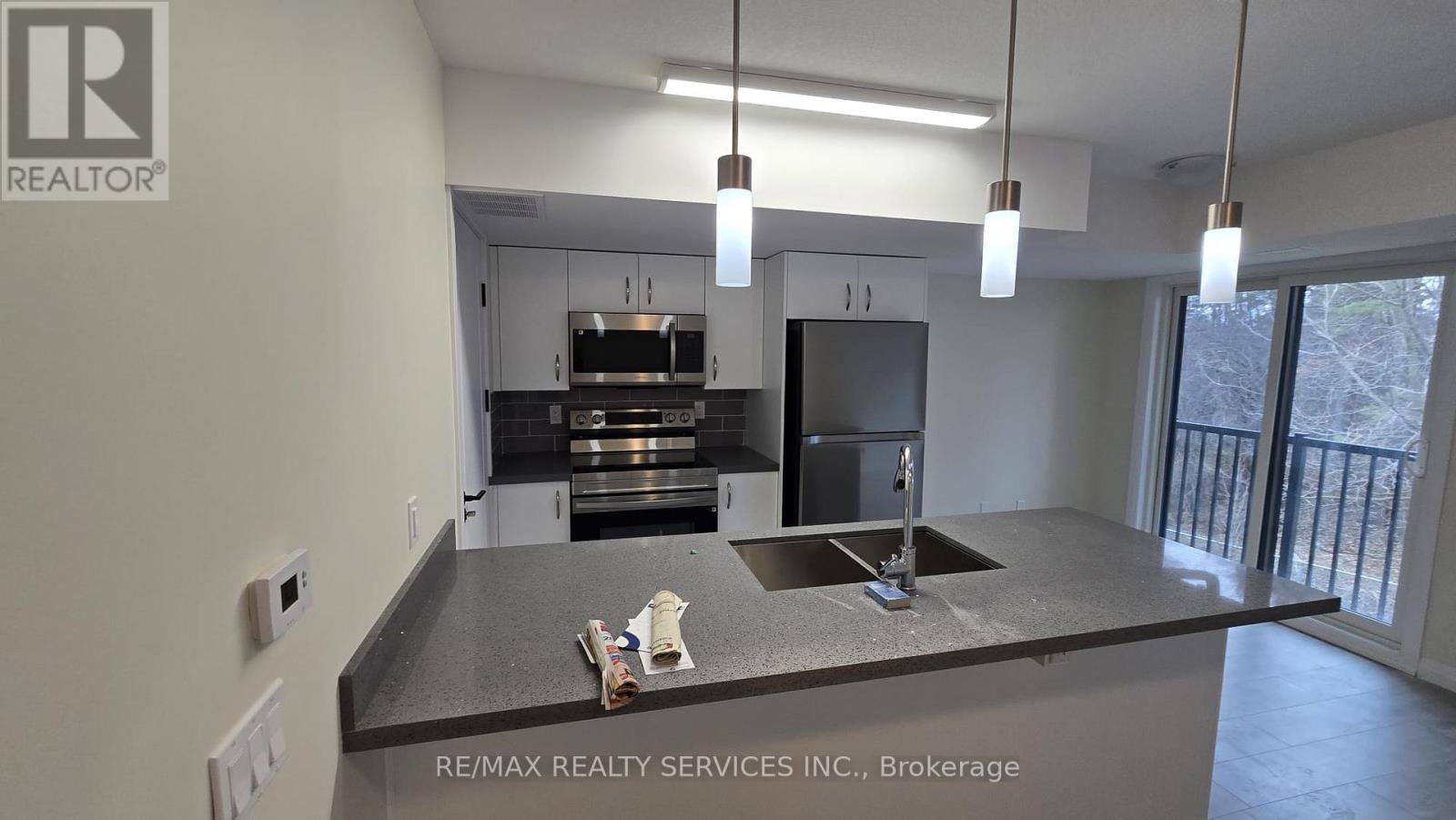 A kitchen with a sink and a countertop.