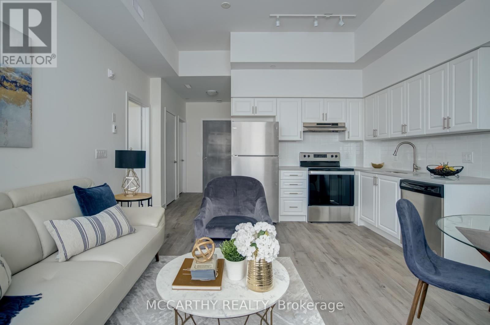 A modern kitchen with a dining table and chairs.