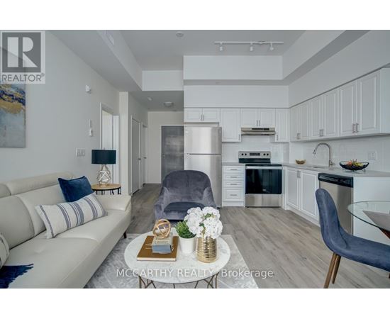 A modern kitchen with a dining table and chairs.