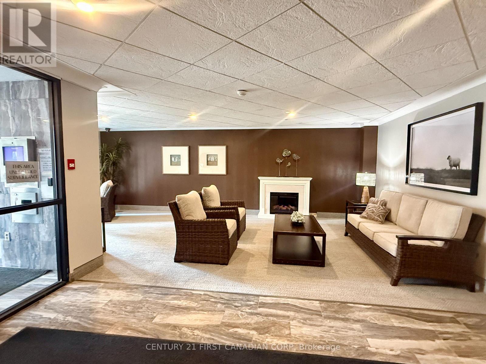 A living room with a fireplace and a couch.