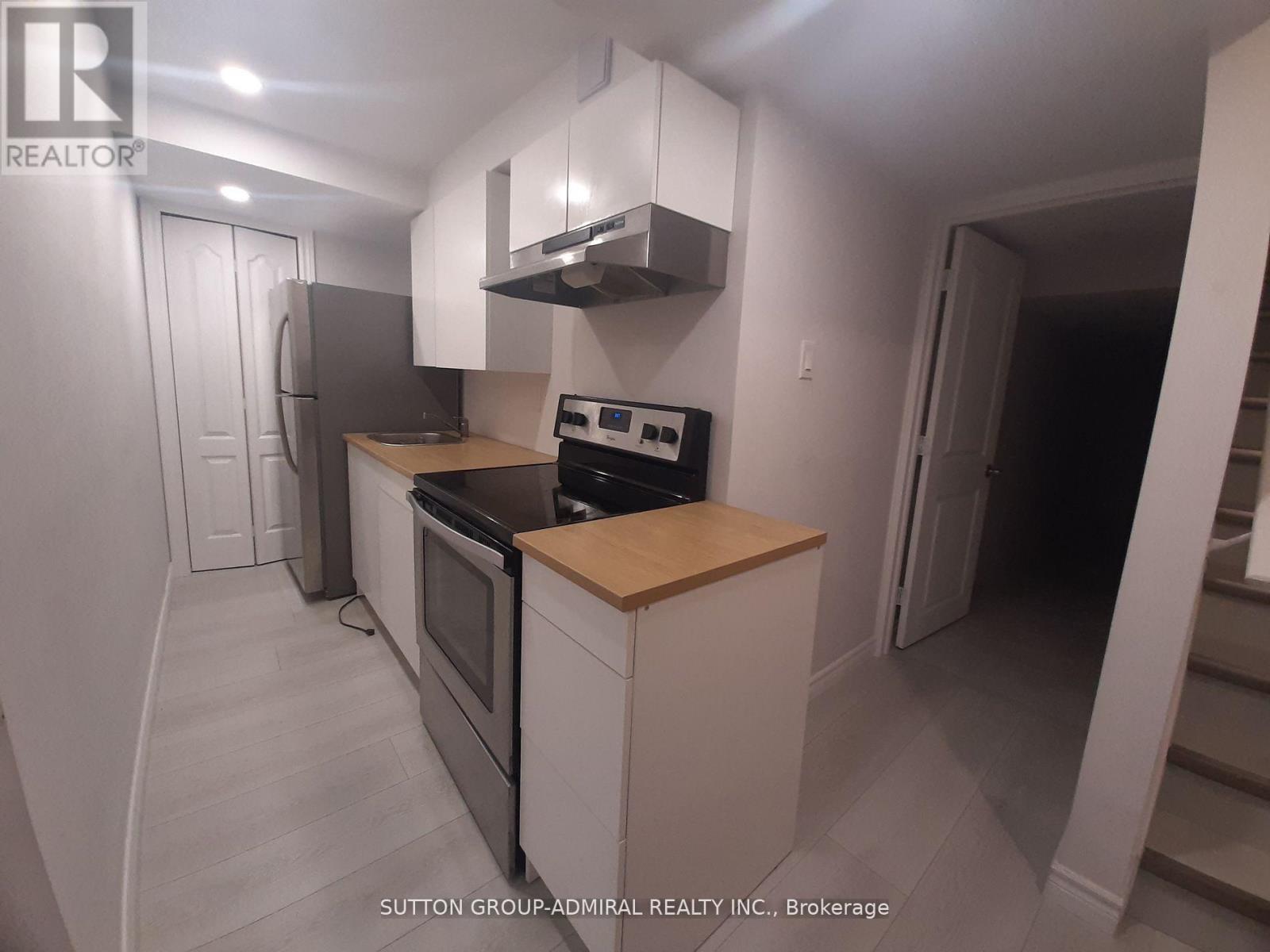 A kitchen with a stove top oven and a microwave.