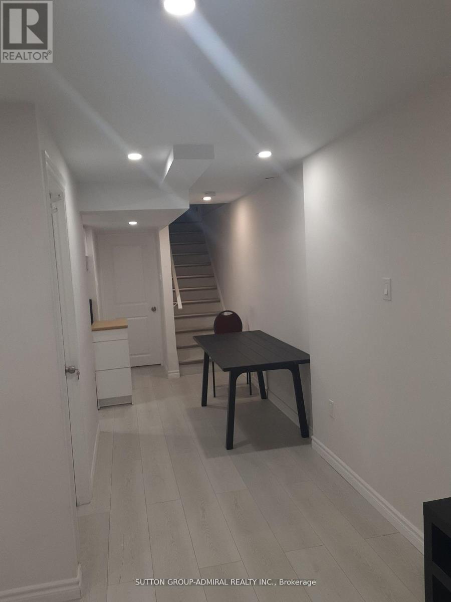 A room with a table and chairs in it.