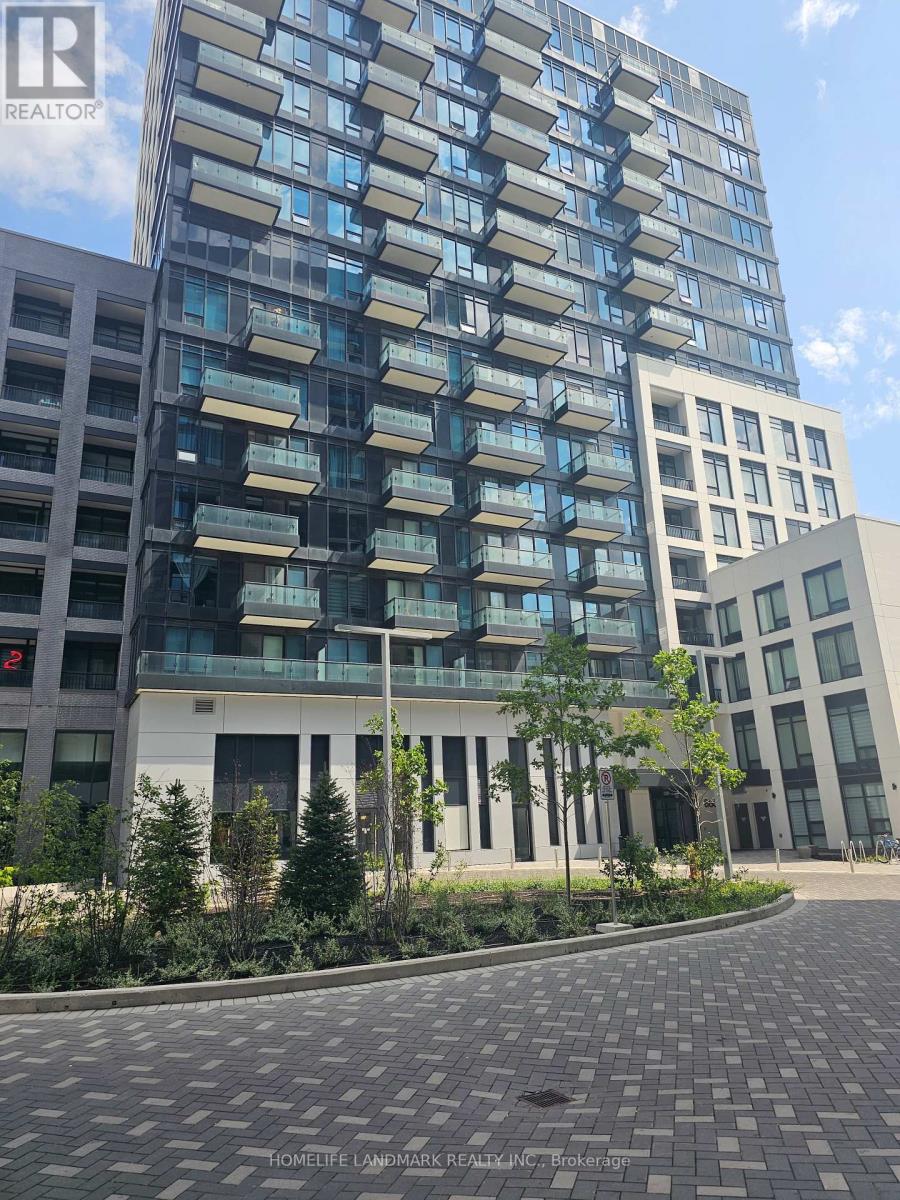 A tall building with balconies is in the background, and a smaller building with a balcony in front of it is in the foreground.