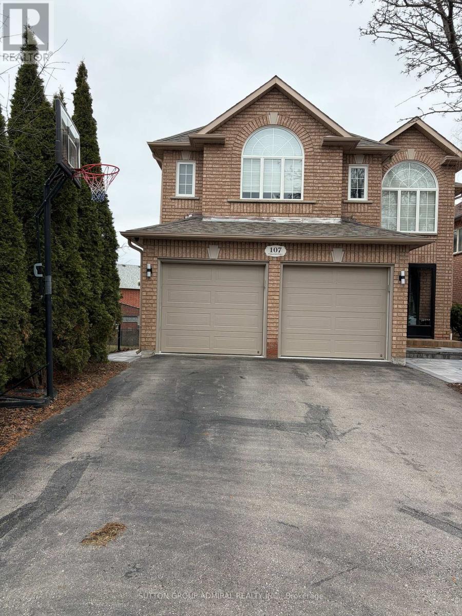 A house with a driveway in front of it.