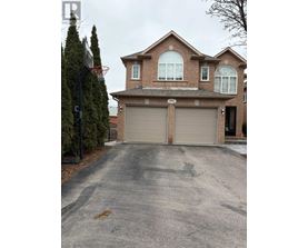 A house with a driveway in front of it.