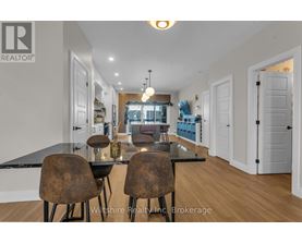 A dining room with a table and chairs is shown.