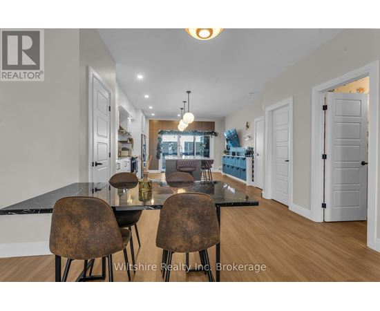 A dining room with a table and chairs is shown.