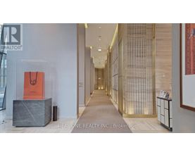 A hallway with a sign that says Real One Realty Inc. Brokerage.