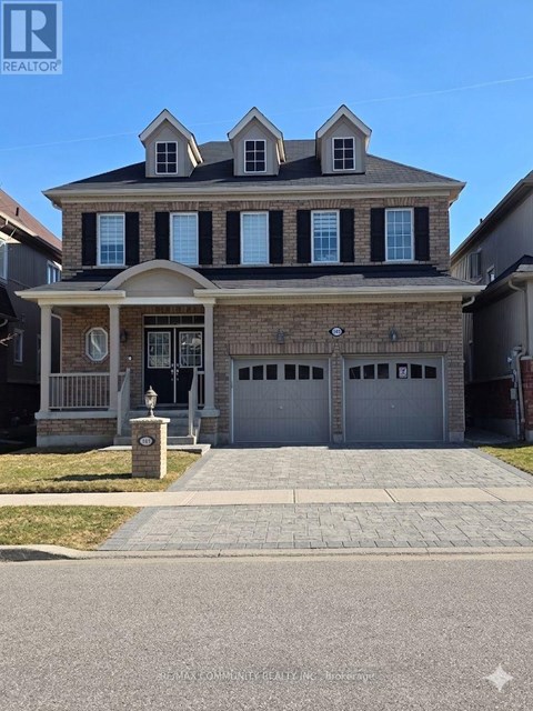 A large house with a garage is for sale.